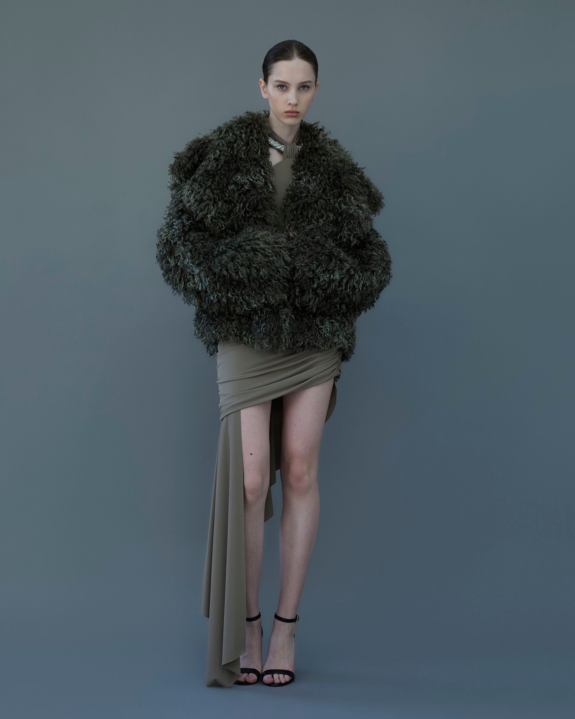 Dark taupe draped jersey dress with ruched detailing and crystal torchon neckline, front view.